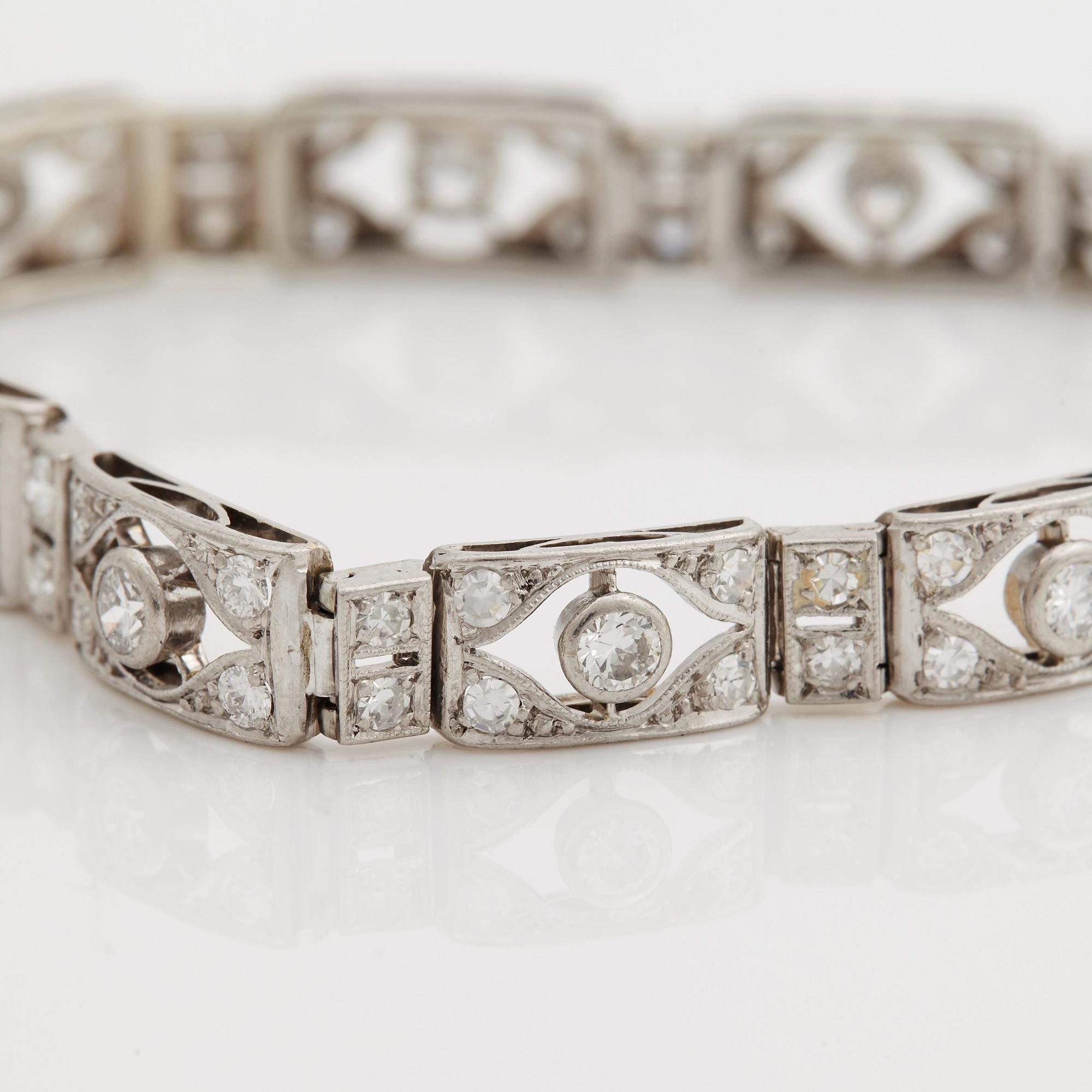 A bracelet set with old and eight cut diamonds.