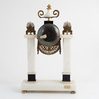 A French Louis XVI ormolu and marble portico clock, late 18th century.