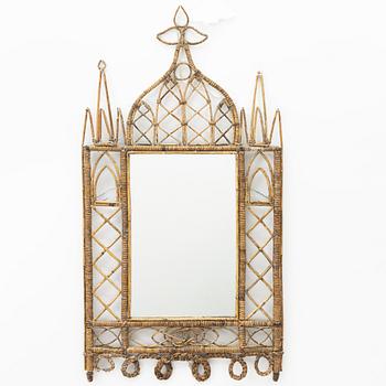 A rattan mirror from around the year 1900.