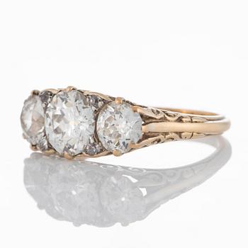 An 18K gold three stone ring with old-cut diamonds with a total weight of ca 3 cts.