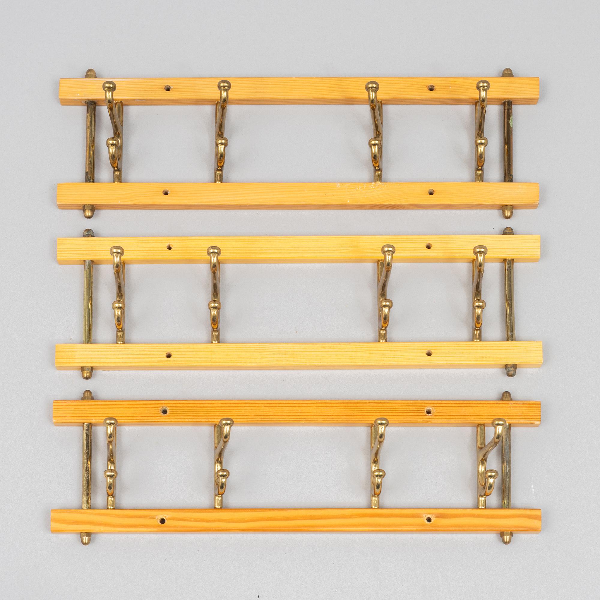 A set of three 'Dekorativ' coat hangers, Skoglunds metallgjuteri, Anderstorp, 1950s/60s.