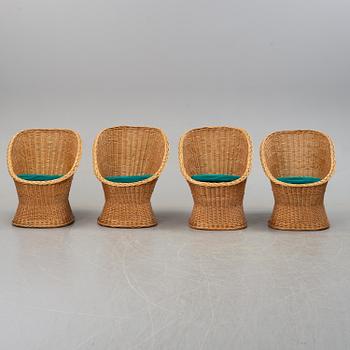 Four second half of the 20th century rattan easy chairs.