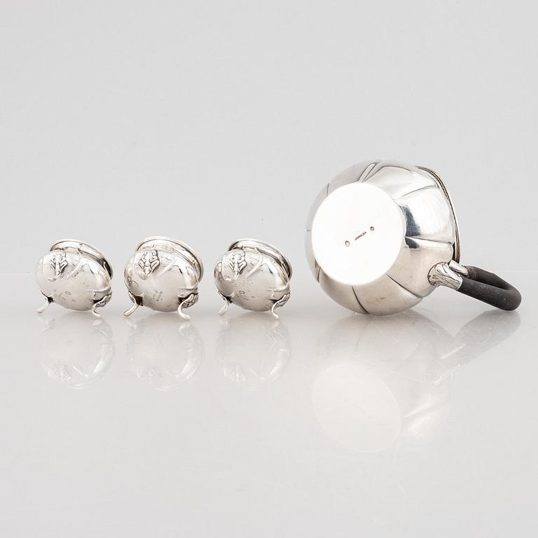 A Danish silver jug and three salt cellars, first half of the 10th Century.