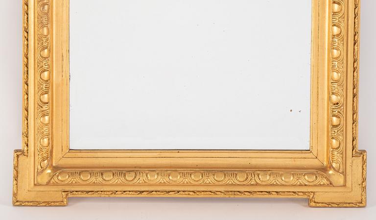 A mirror and console table from around the year 1900.