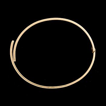 ARMRING, 18k guld besatt med diamant, ca 0,05 ct. Cartier. Vikt ca 39 g.
