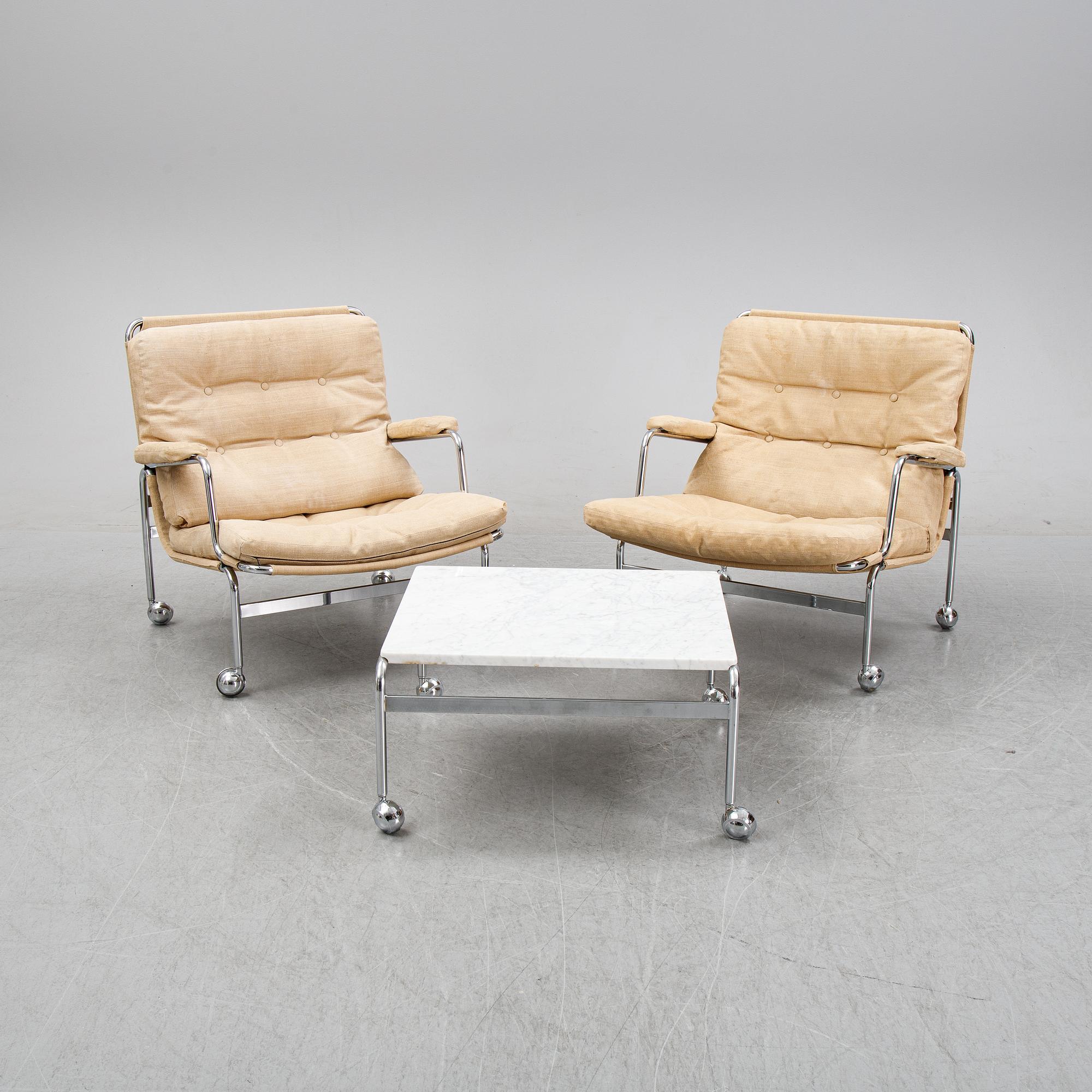 Bruno Mathsson, a pair of easy chairs and a coffee table, 'Karin', Dux, second half of the 20th Century.