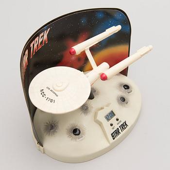 Three Vintage Toy Robots and a Table Clock.