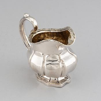 A Russian 19th century parcel-gilt silver cream-jug, mark of Abraham Forstedt, St. Petersburg 1840.