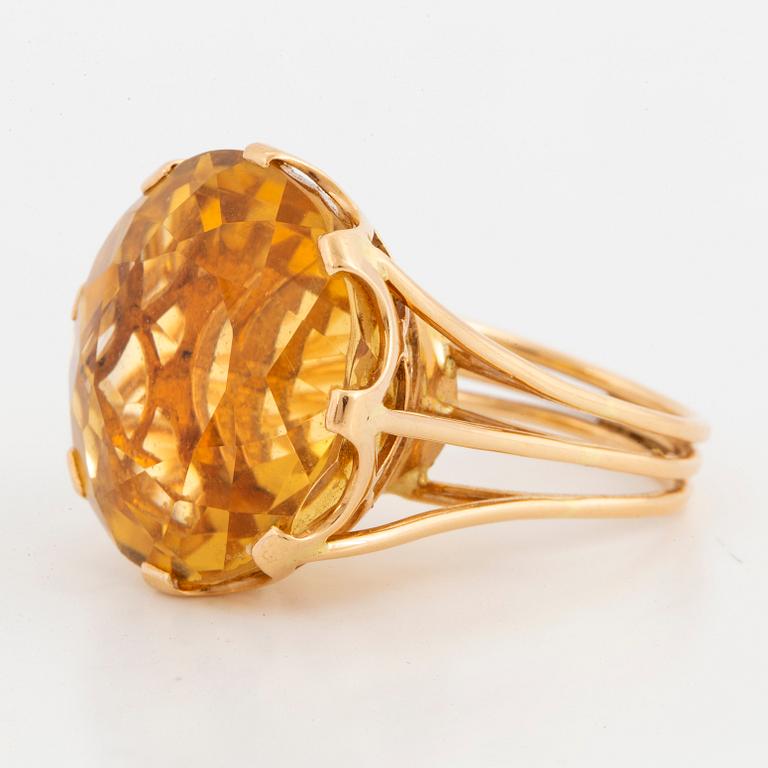 Round mixed-cut citrine cocktail ring.