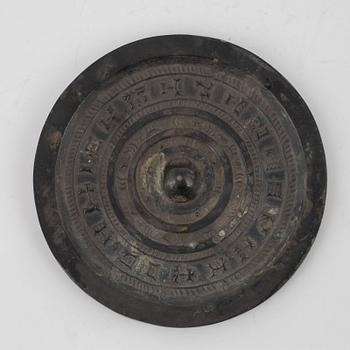 Four bronze lobed mirrors,  Han dynasty (206 B.C.-220 A.D.).