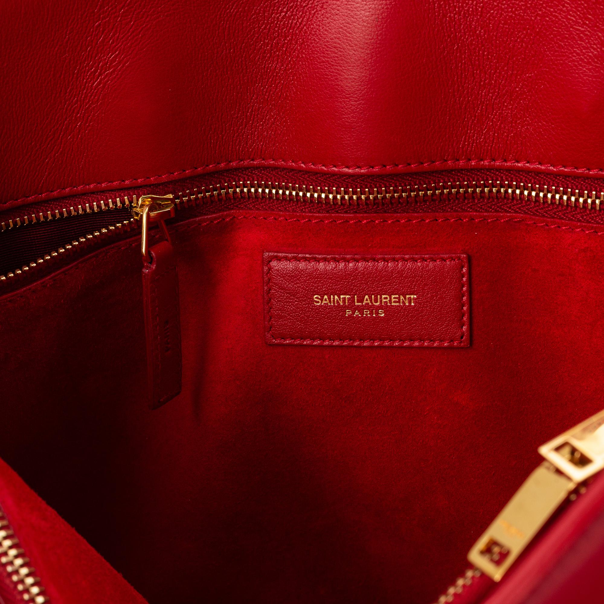 Saint Laurent, a red leather 'Sac du Jour Small' bag.