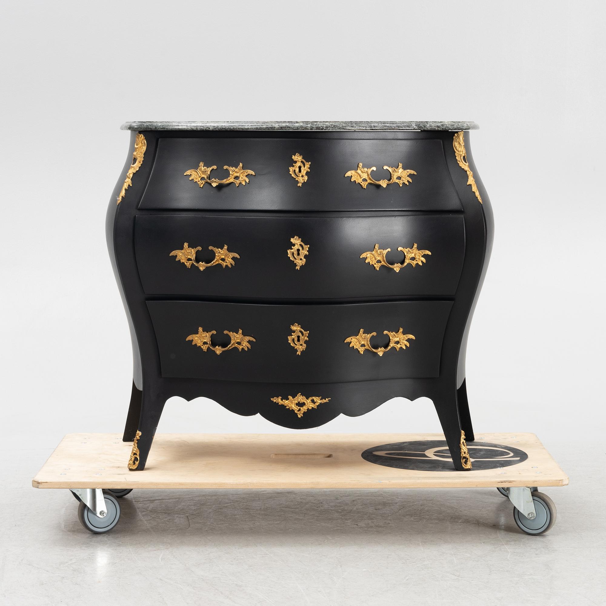 A Rococo style chest of drawers, mid 20th Century.