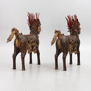 A pair of large Qilin sculptures, lacquered wood, first part of the 20th century.