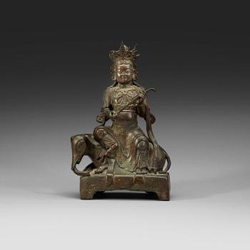1324. A seated bronze figure of Guanyin on an elephant, Qing dynasty, 19th Century.