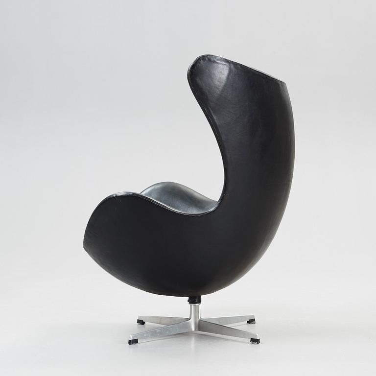 An Arne Jacobsen black leather 'Egg' chair, Fritz Hansen, Denmark 1964.