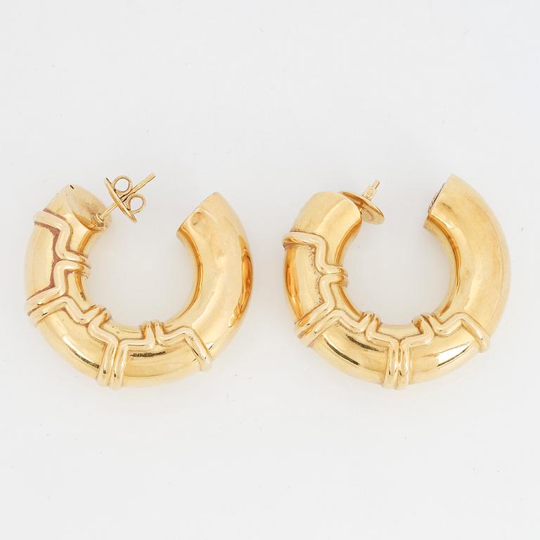 A pair of 18K gold earrings.