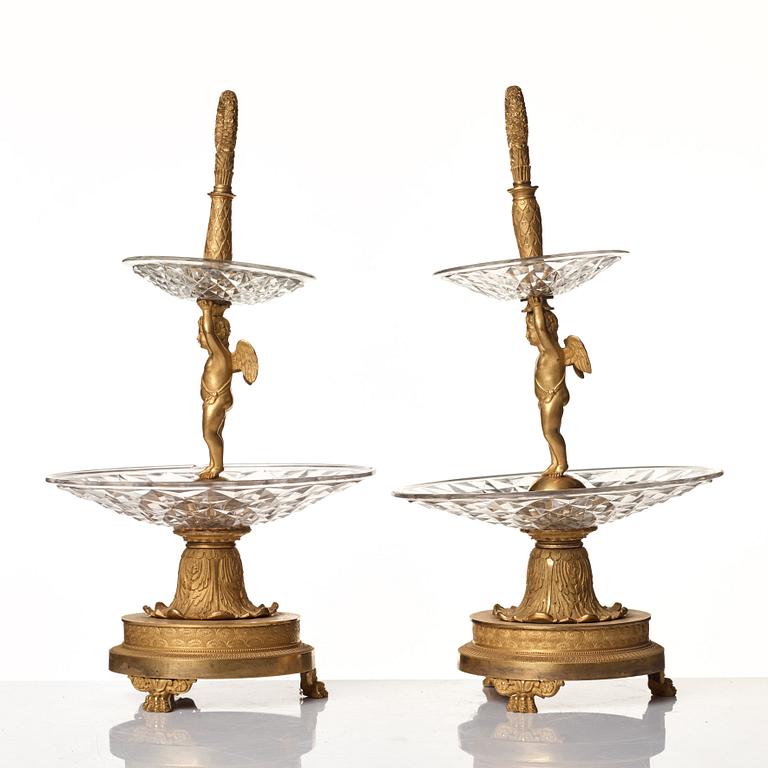 A pair of French Empire early 19th century gilt bronze and glass centre pieces in the manner of Pierre Philippe Thomire.