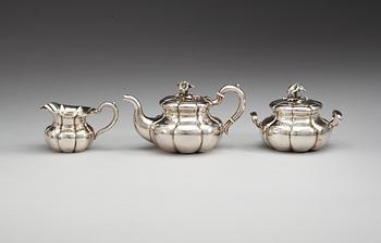 A Russian 19th century parcel-gilt three piece tea-set, makers mark of Carl Siewers, S:t Petersburg 1858.