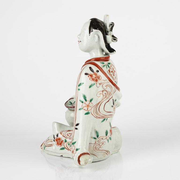 A Japanese porcelain figure, 18th century.