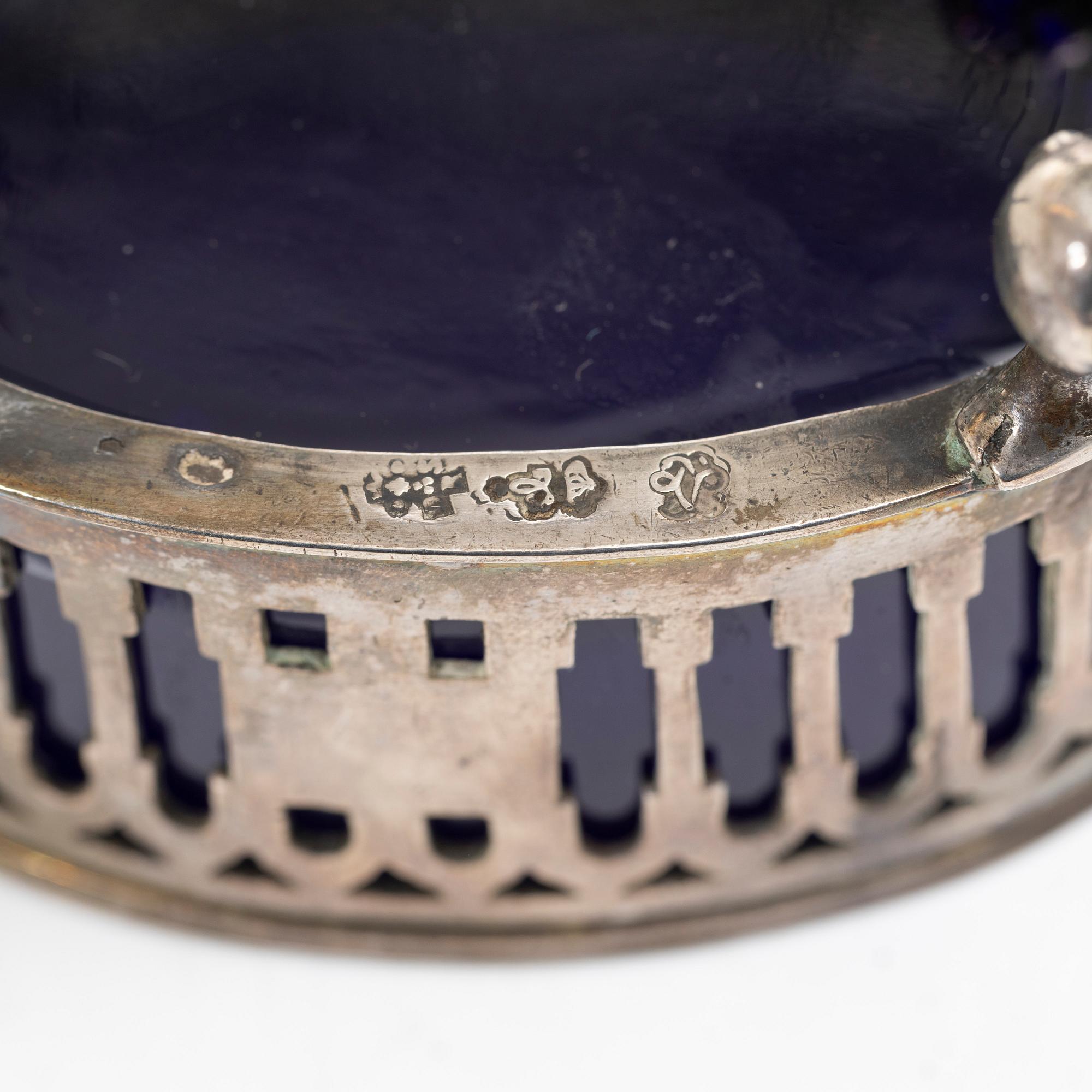 Two silver salt cellars, and a mustard pot, French hallmarks, late 18th Century.