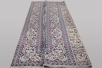 A carpet, Nain, part silk, ca 426 x 309 cm.