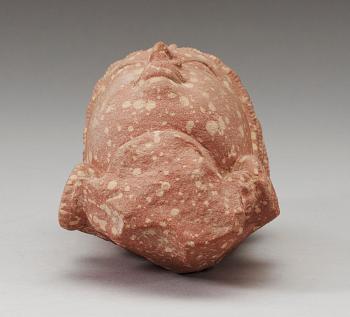 A mottled red sandstone head of Guanyin, Mathura, India, presumably 200-500 AD.