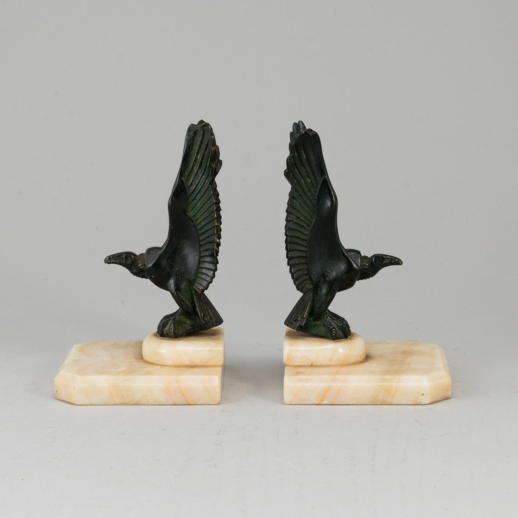 A pair of art déco marble and bronze book ends, 1930s.