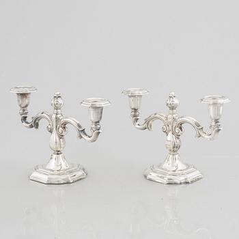 A pair of Swedish silver candelabras, marks of CG Hallberg, Stockholm 1959.