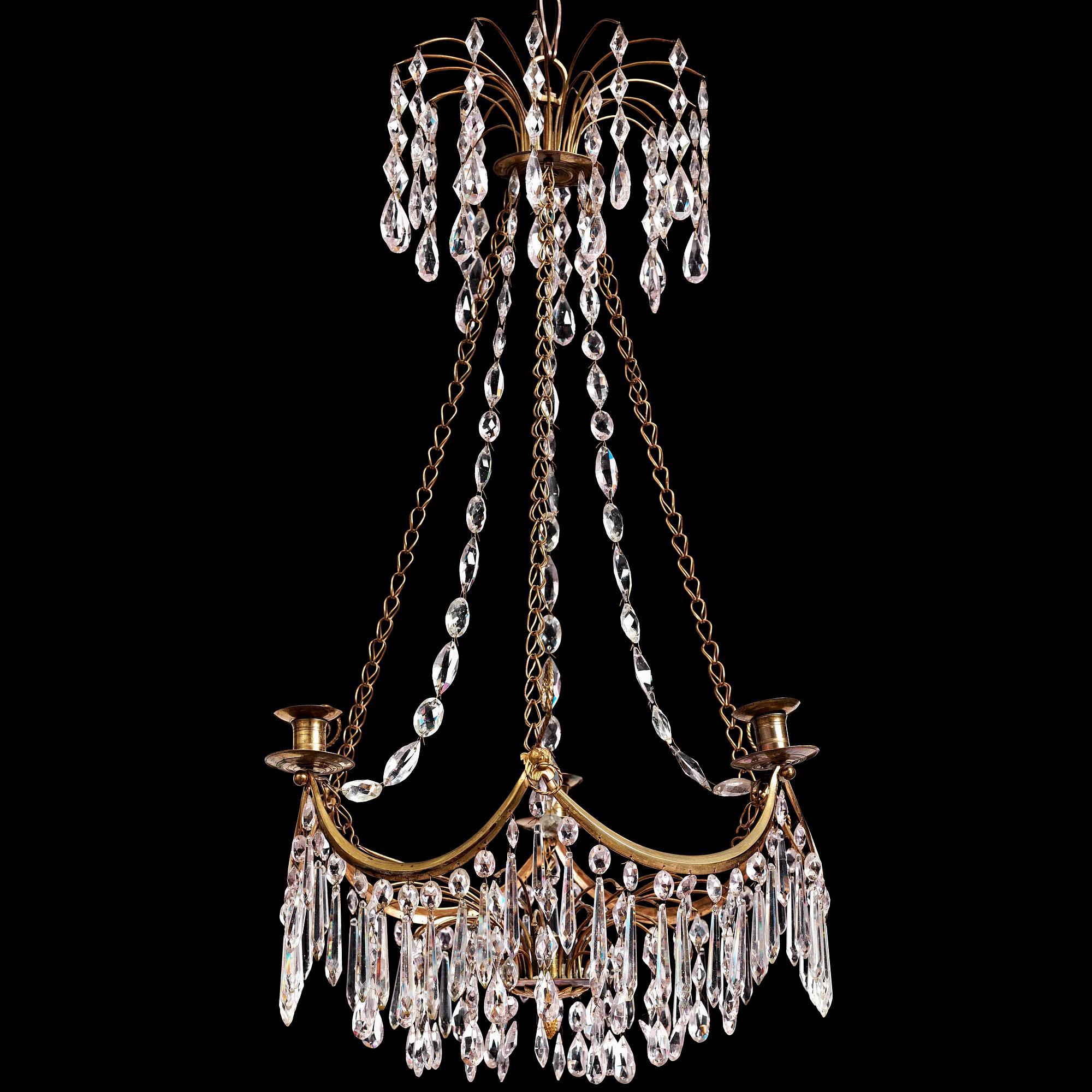 A Gustavian gilt brass and cut glass four-light chandelier, Stockholm, late 18th century.