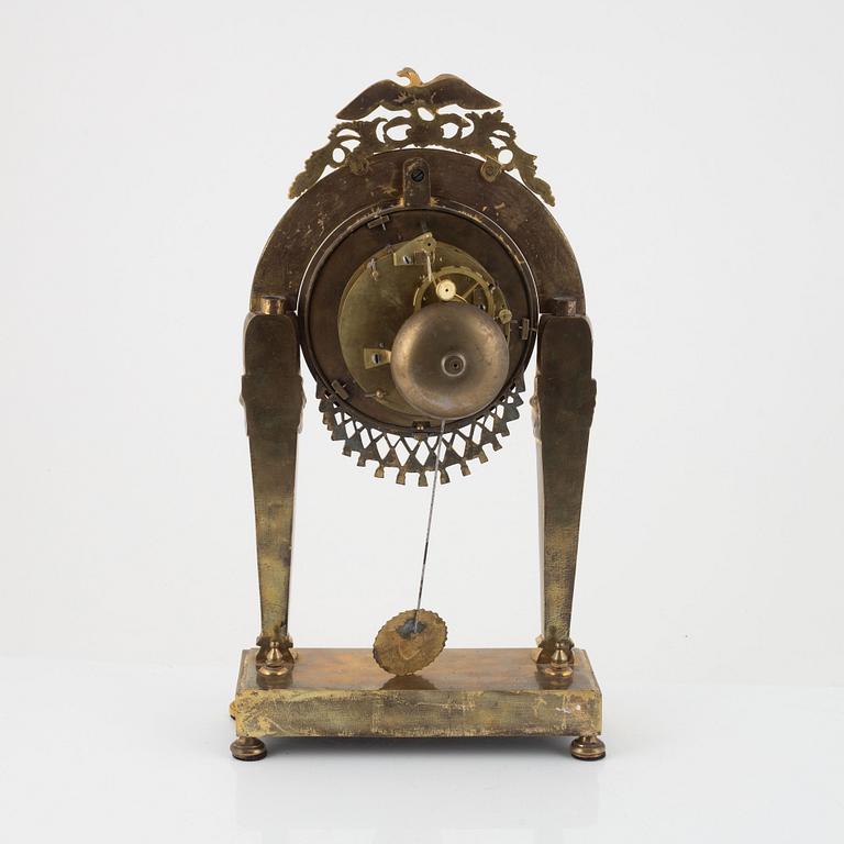 A French Empire ormolu portico mantel clock, eatly 19th century.