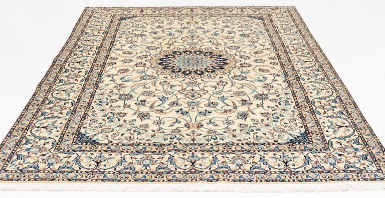 A carpet, Nain, part silk, fine 9 laa, signed, ca 327 x 210 cm.