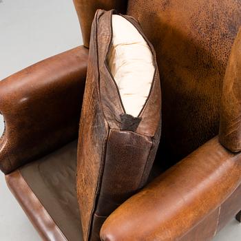 A Chesterfield style armchair from the latter part of the 20th century.