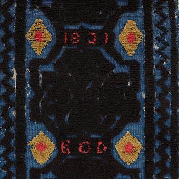 A carrige cushion, knotted pile in relief, ca 46,5 x 101 cm (with mounting 51 x 103,5 cm), probably Bara district,