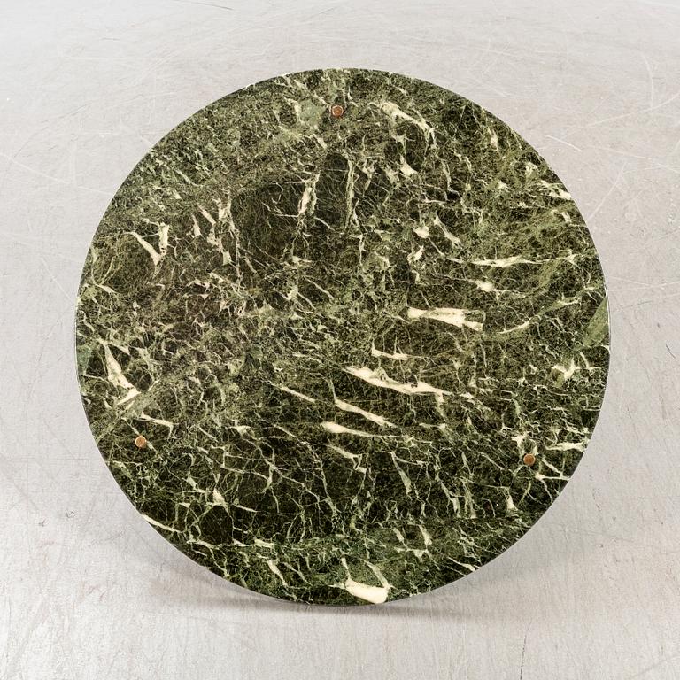 A marble coffee table alter part of the 20th century.