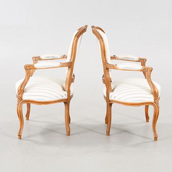 A pair of mid 20th century armchairs.