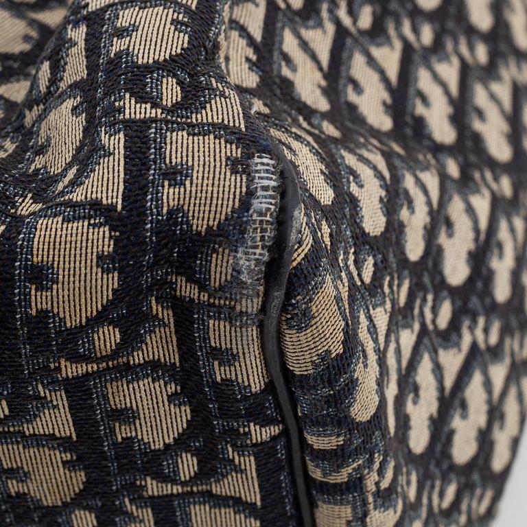 Christian Dior, a canvas handbag, toilet bag and key holder.