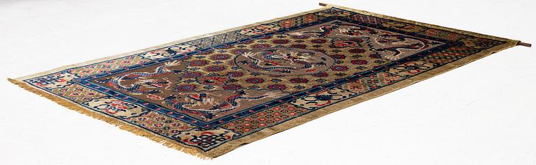 A Chinese silk and metal thread yellow ground 'five clawed dragon' carpet, Qing dynasty, 19th century. (Measure 208x126).