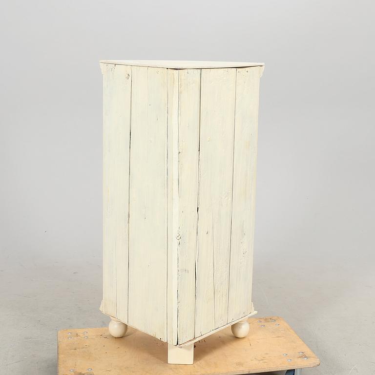 A painted 19th century corner cabinet.