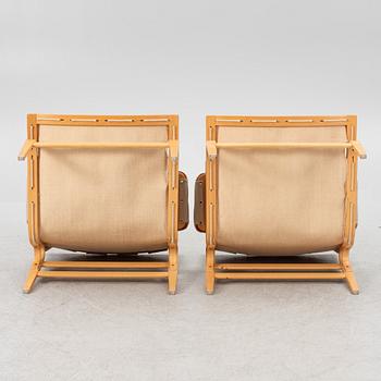 Bruno Mathsson, a pair of "Ingrid" armchairs, Dux, Sweden, second half of the 20th century.