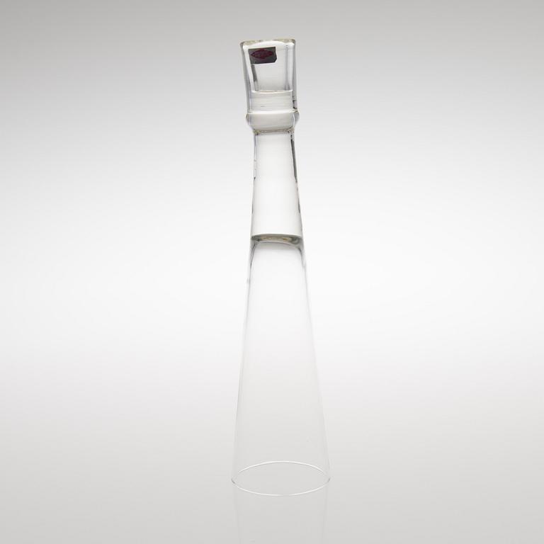 A GLASS CANDLESTICK, label marked Nuutajärvi Notsjö Boutique.