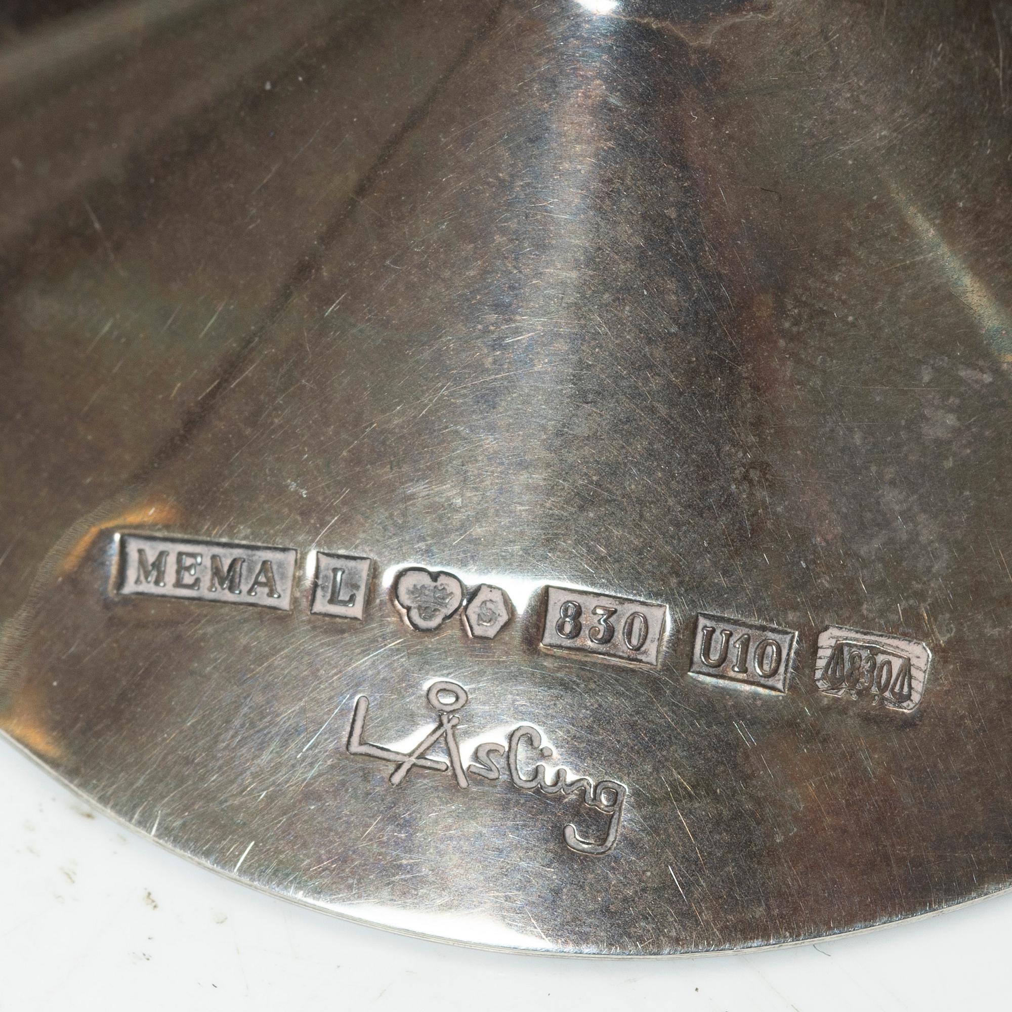 Two vodka glasses, one in silver by Lars Åsling, 1994, and one in pewter, 1977.