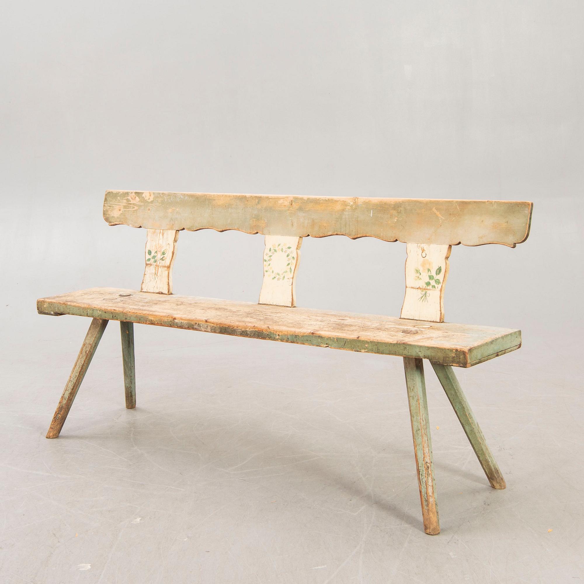 A painted early 1900s bench.