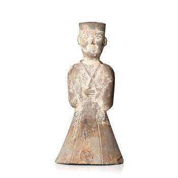 A pottery figure of a standing male figure, Han dynasty (206 BC - 220 AD).