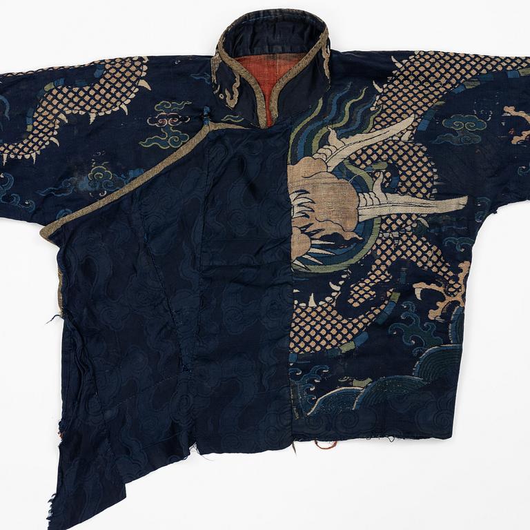 A rare fragment of a silk four clawed 'dragon' jacket, late Ming dynasty/early Qing dynasty.