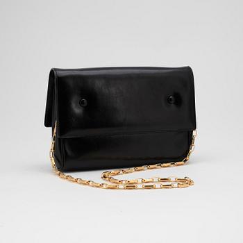 CÉLINE, a black leather evening bag.