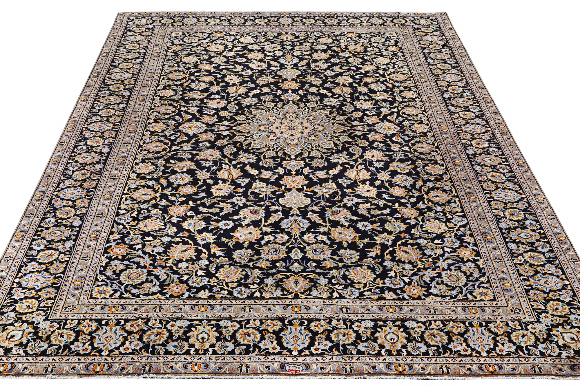 A Kashan carpet, c. 410 x 270 cm.