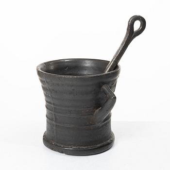 Mortar and pestle, dated 1673.