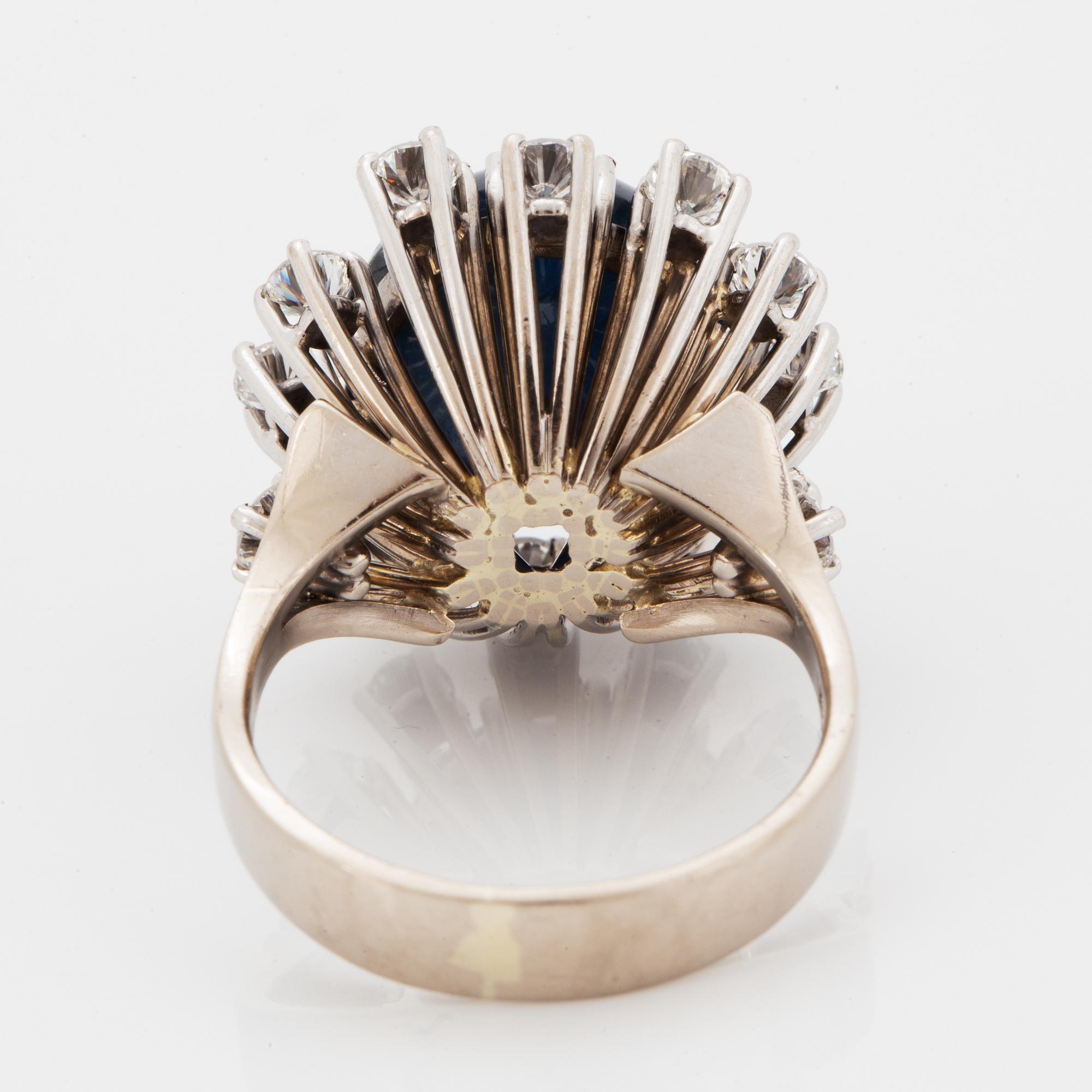 Cabochon-cut sapphire and brilliant-cut diamond cocktail ring.