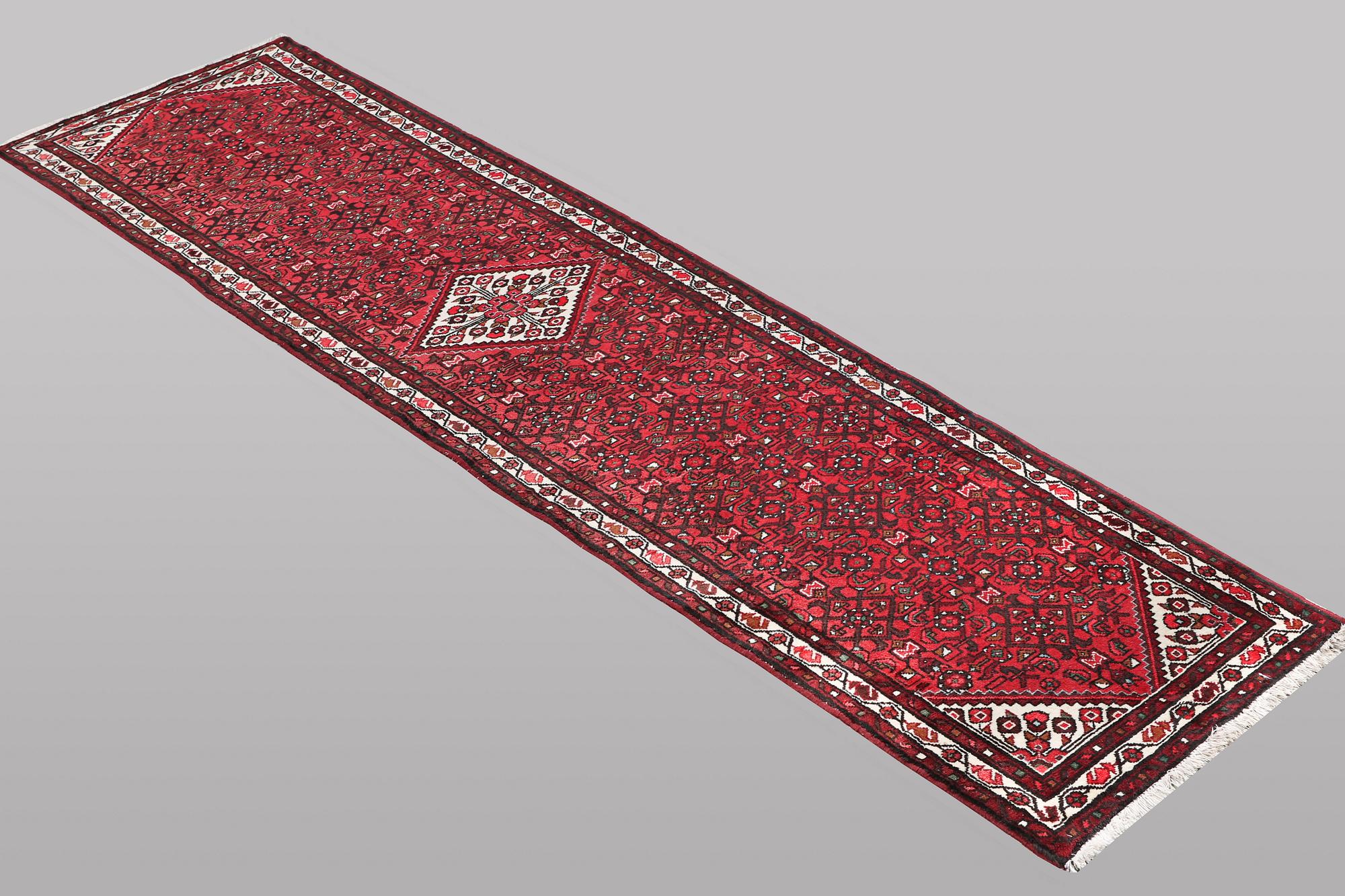 A runner carpet, Hosseinabad, ca 393 x 82 cm.