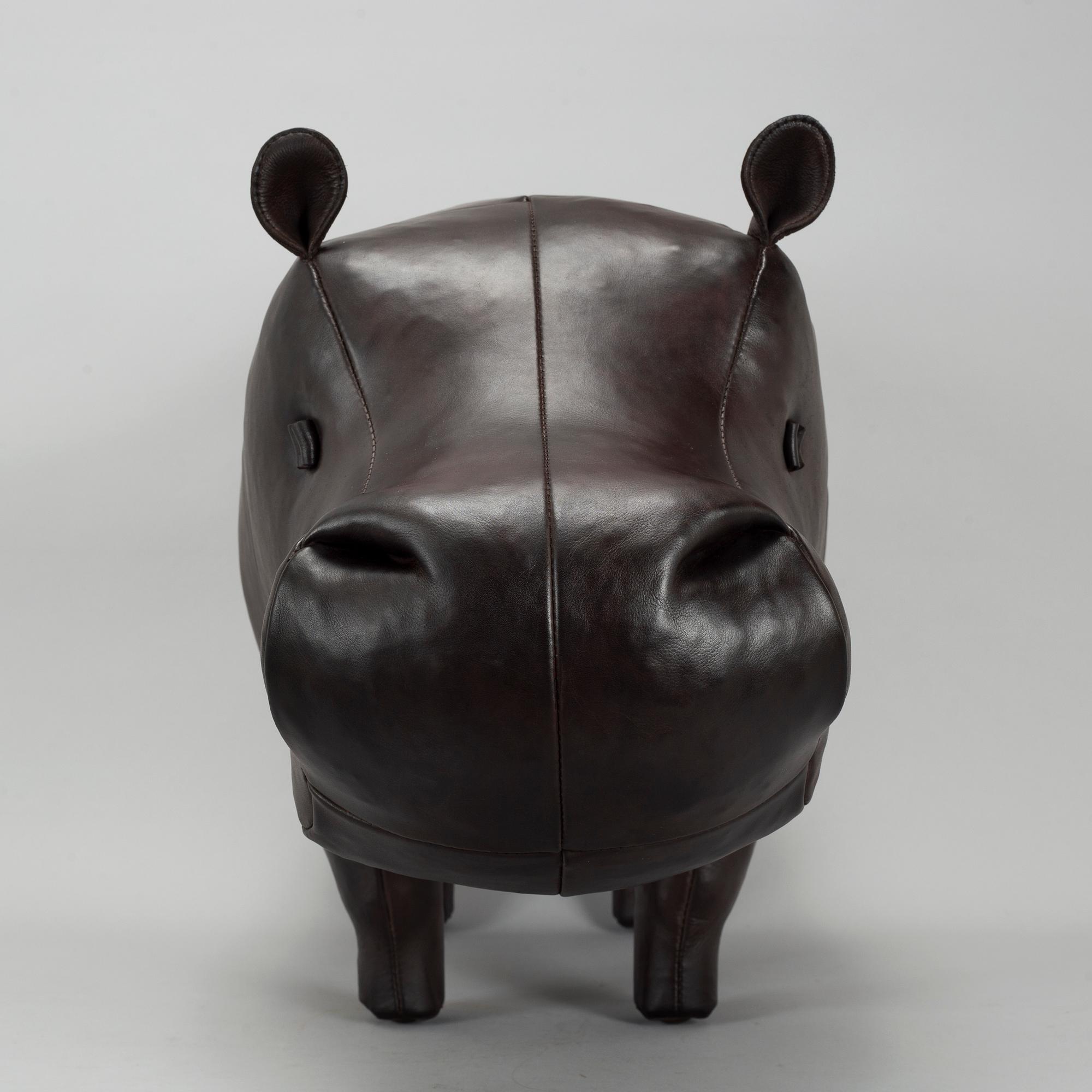 A leather footstool by Dimitri Omersa & Co.